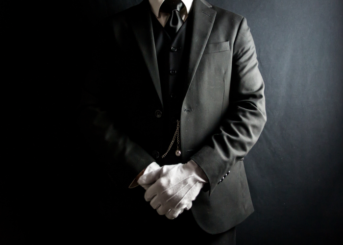 Funeral Director in white gloves