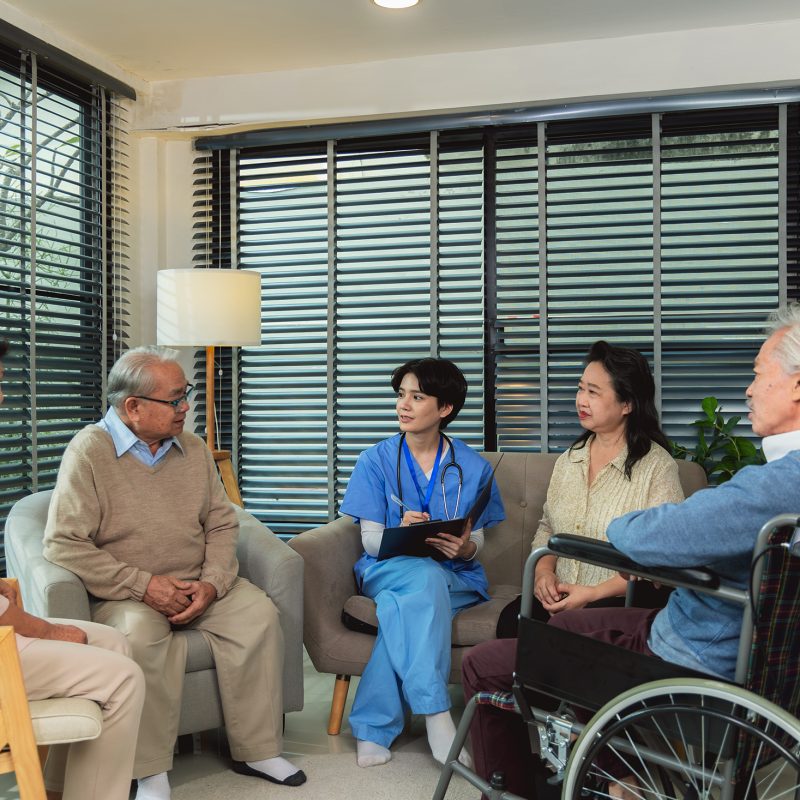 A group of Asian elderly in a health center meeting with a doctor for medication and an annual check-up. Senior people listening to nurse counselor take care mental health