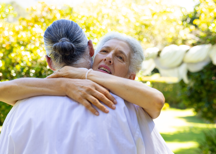 senior-couple-affectionately-embracing-in-garden
